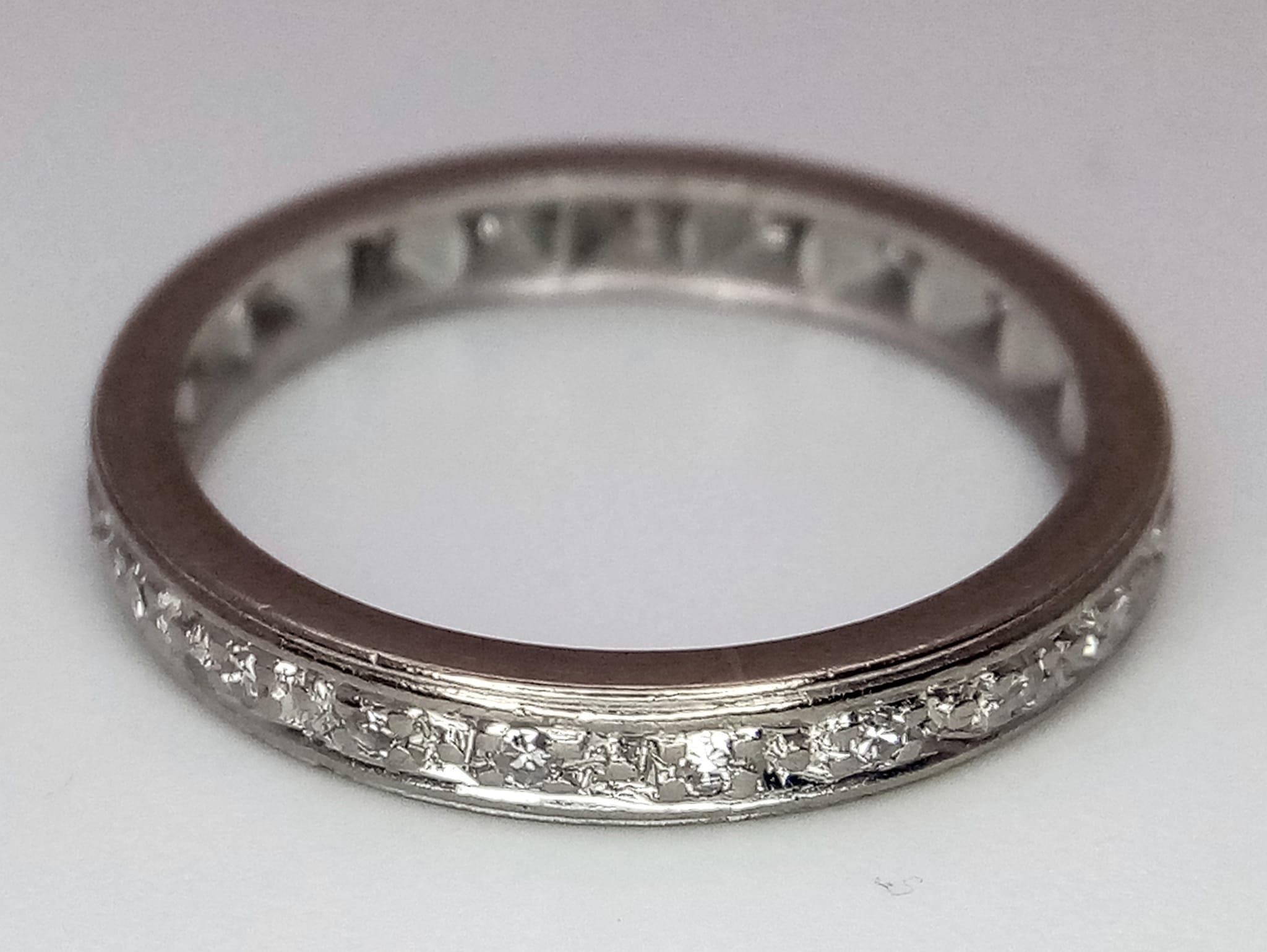 A VINTAGE 18K WHITE GOLD DIAMOND FULL ETERNITY RING. Size L/M, 2.9g total weight. - Image 3 of 3