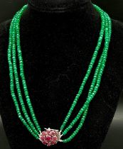 A Three Row Emerald Necklace with a Ruby and 925 Silver Clasp. 47.5cm in length, 250ctw emeralds,