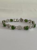 SILVER and GREEN CHALCEDONY BRACELET set with SILVER CHINESE SYMBOLS Separating the gemstones.