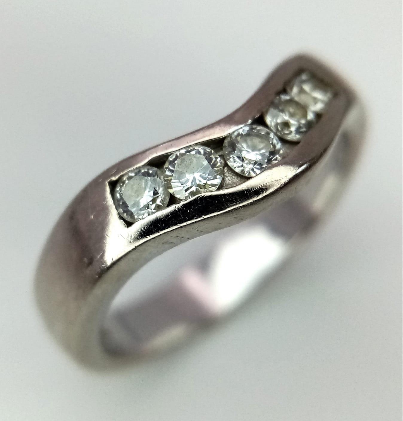 An 18K White Gold Five Stone Diamond Ring. 0.25ctw. Size M. 5.65g total weight. Ref: 14436
