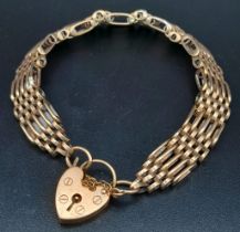 A vintage (but in vogue again!!!) 9 K yellow gold articulate bracelet with a heart shaped padlock