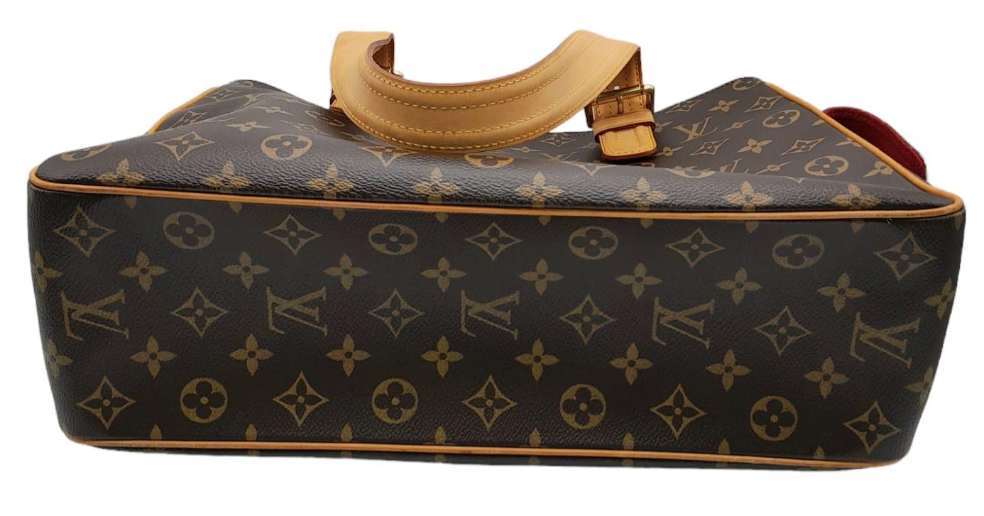 A Louis Vuitton Monogram Multiple Cite Bag. Leather exterior with gold hardware and top zip. Two - Image 4 of 10