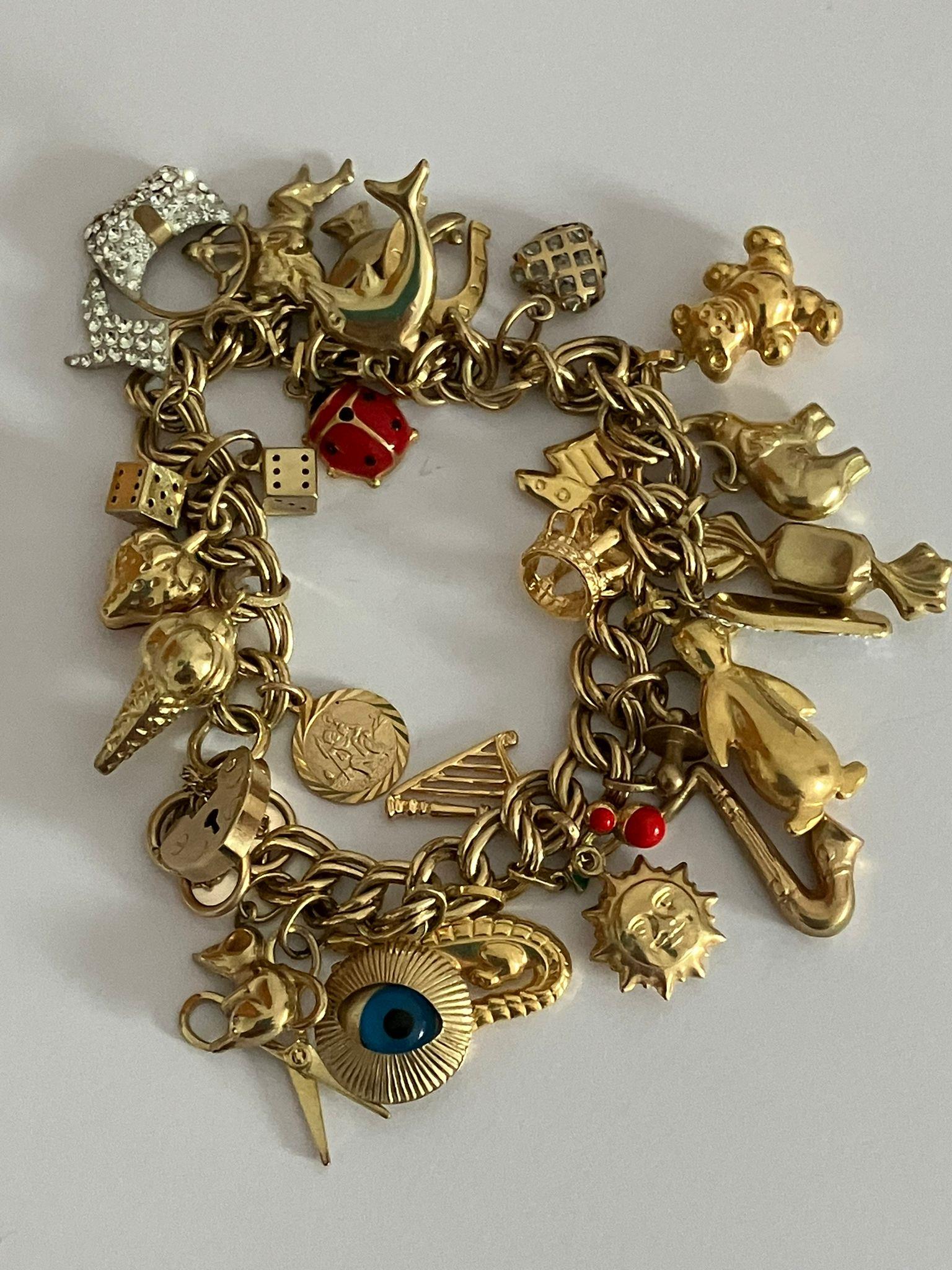 9 carat GOLD CHARM BRACELET Absolutely full of Gold charms, To include Dolphin, Ladybird, Magic - Image 2 of 6