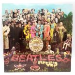 The Beatles Sgt Pepper Vinyl Album with Original Cut-Out Poster. EMI - 1967 issue.