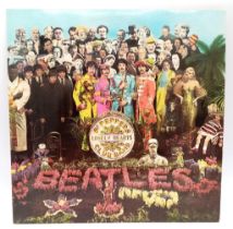 The Beatles Sgt Pepper Vinyl Album with Original Cut-Out Poster. EMI - 1967 issue.