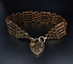 A VINTAGE 9K ROSE GOLD GATE BRACELET WITH INDIVIDUAL HALLMARKS ON EVERY GATE AND HEART SHAPED