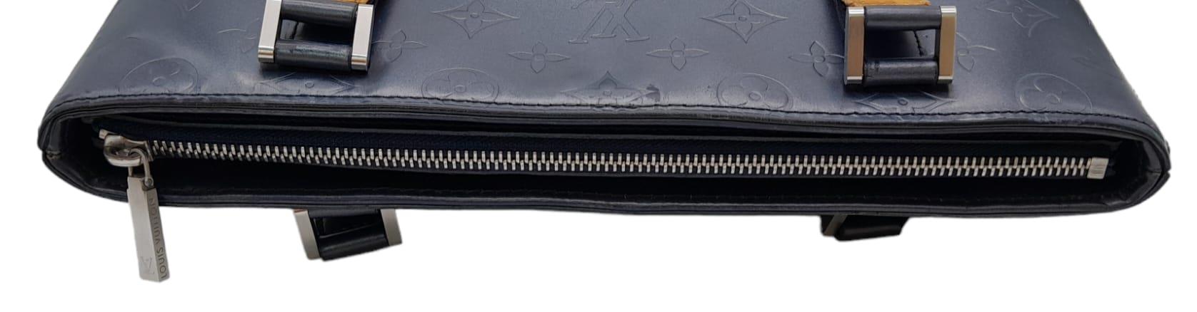 A Louis Vuitton Metallic Grey 'Stockton' Bag. Monogram leather exterior with silver-tone hardware - Image 5 of 9