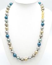 A Multi-Coloured South Sea Pearl Shell Bead Necklace. Gilded, silver and blue beads -12mm. 48cm.