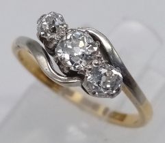 AN ANTIQUE 18K YELLOW GOLD & PLATINUM, OLD CUT DIAMOND 3 STONE TWIST RING. Size J, 0.50ctw, 2.3g