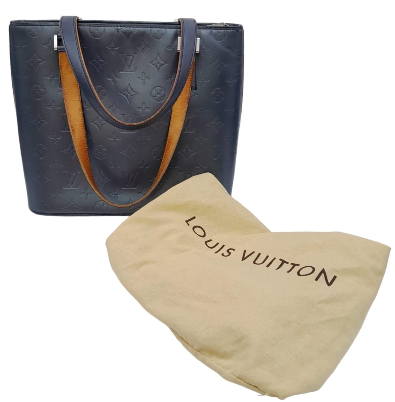 A Louis Vuitton Metallic Grey 'Stockton' Bag. Monogram leather exterior with silver-tone hardware
