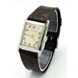 A RARE vintage Patek Philippe & Co watch with Breguet numbers. 27 x 23 mm white metal case. Cream
