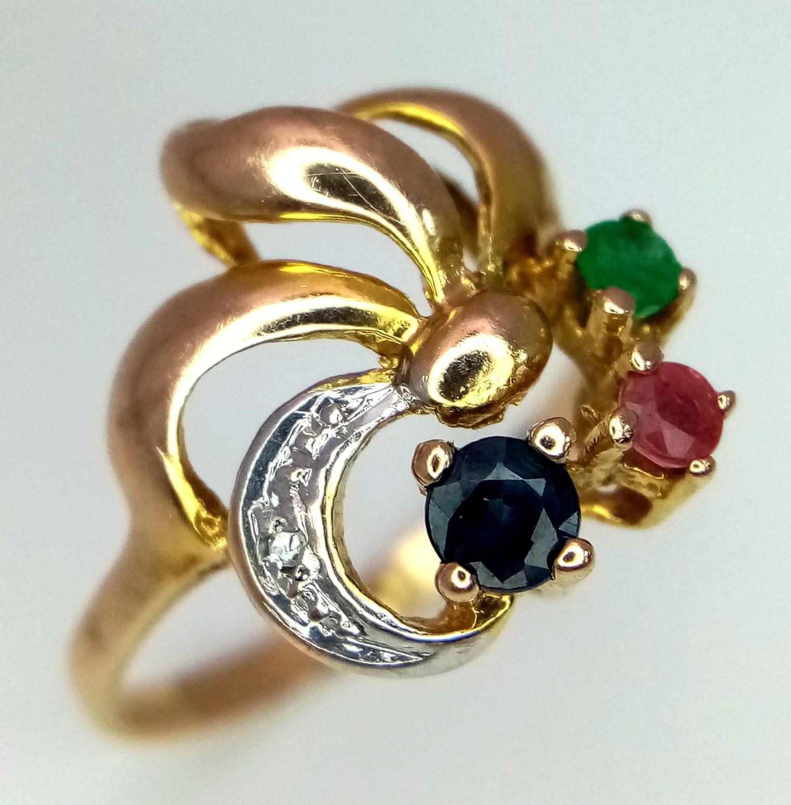 A 9K Yellow Gold Mixed Gemstone Ring. Emerald, ruby, sapphire and diamond. Size O. 2.26g total - Image 2 of 4