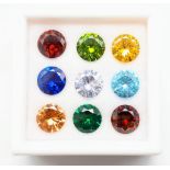 A mesmerising eclectic collection of nine, round cut TOPAZ stones of various colours, Diameter of