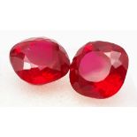 A very desirable pair of cushion cut, RUBIES. Strong “pigeon blood red” colour, with bright