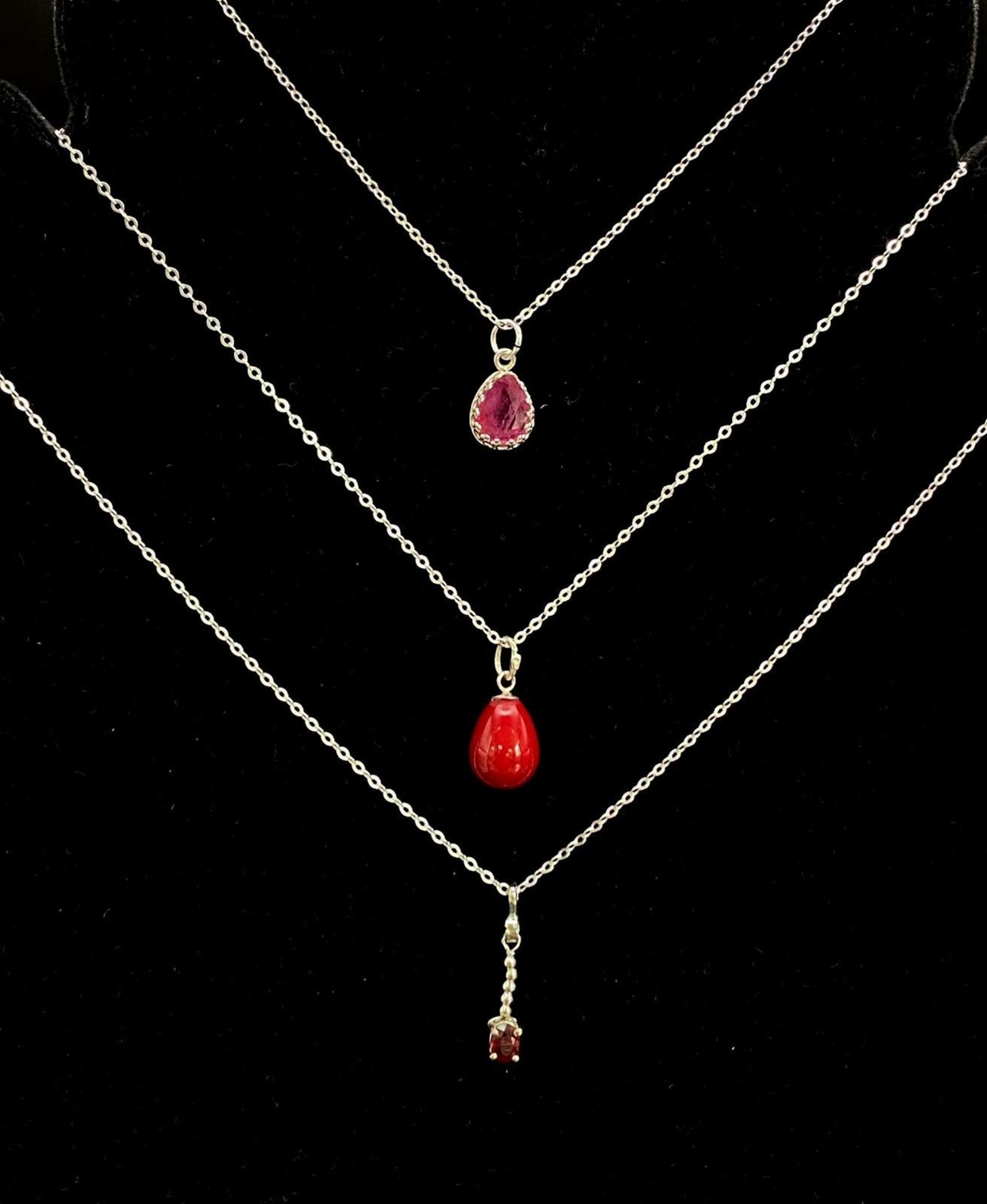 Trio of Sterling Silver Necklaces. Featuring two varieties of Ruby pendants. A classic collection.
