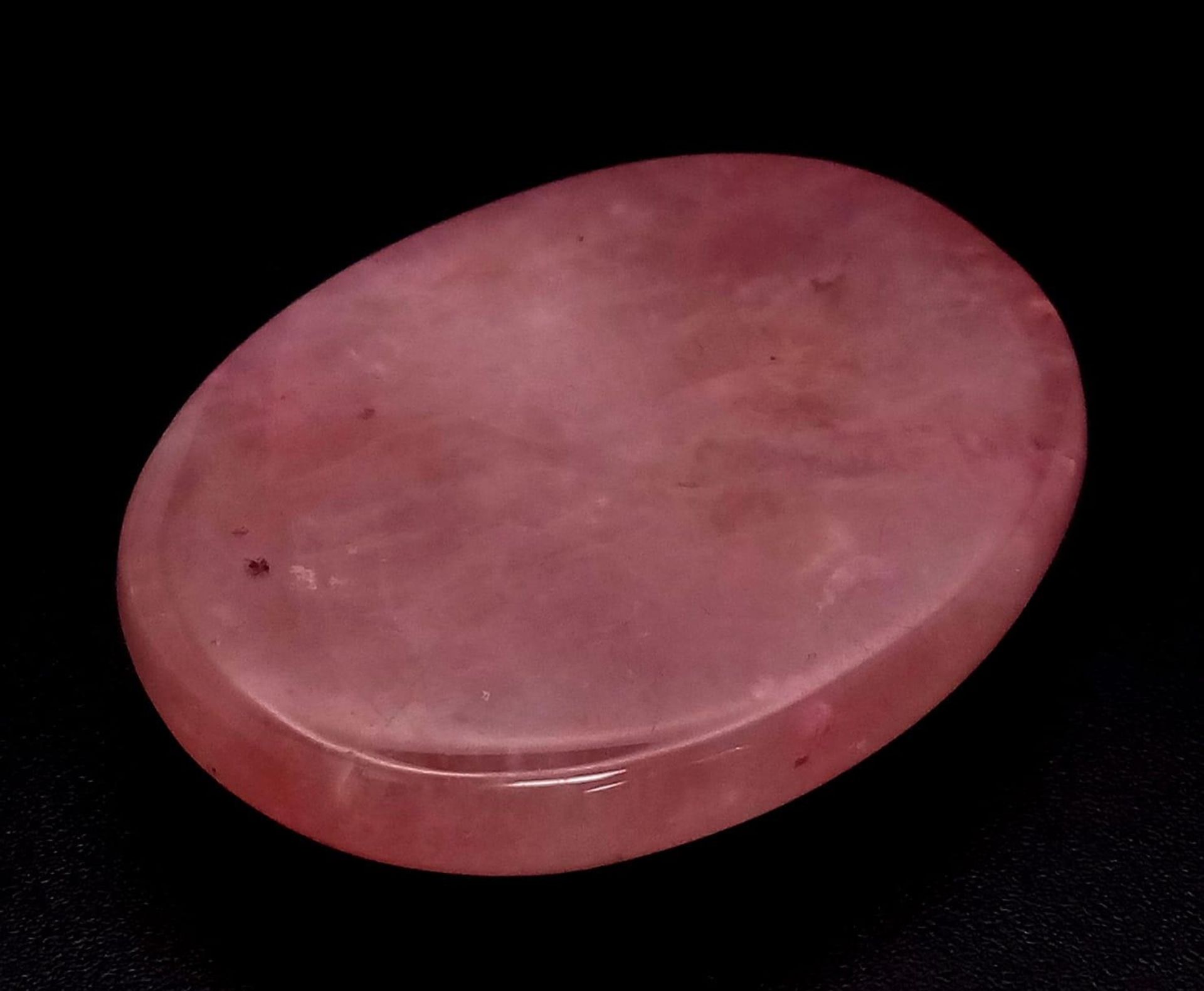 A 68.50ct Natural Madagascar Rose Quartz, in Oval Cabochon shape. Comes with the GLI certificate.