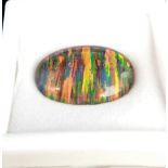 A truly magnificent, large (17.2 carats) GIBSON OPAL oval cabochon. Strong red and metallic green