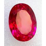 A top quality, large (51.7 carats), oval cut RUBY. Excellent colour saturation and uniformity,