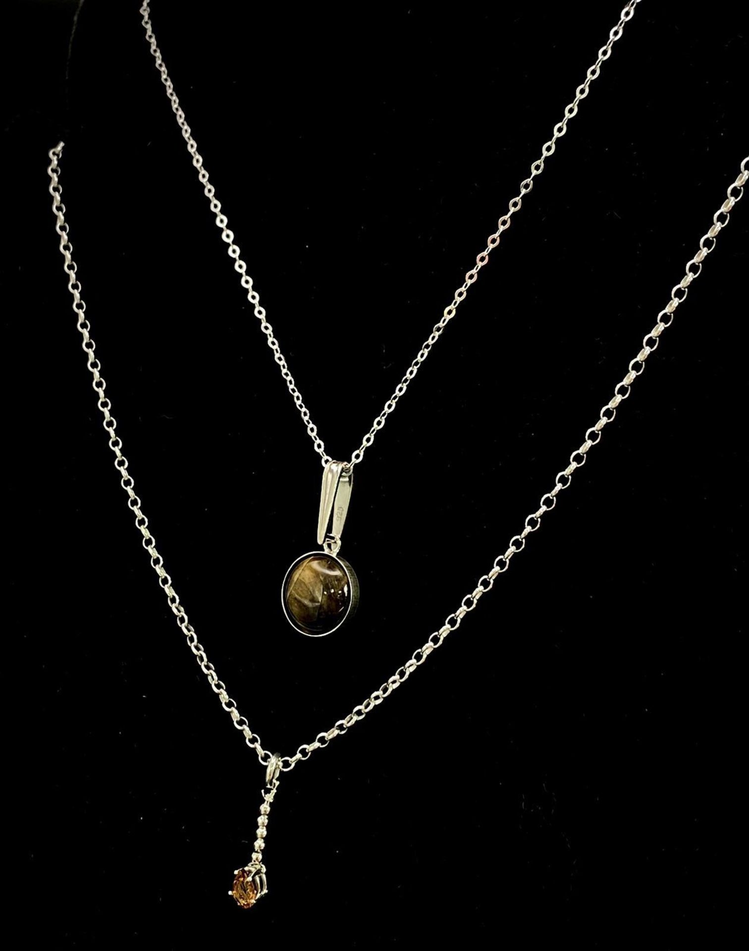 Two Sterling Silver Necklaces with Gemstone pendants. Both measuring 40cm in length, both