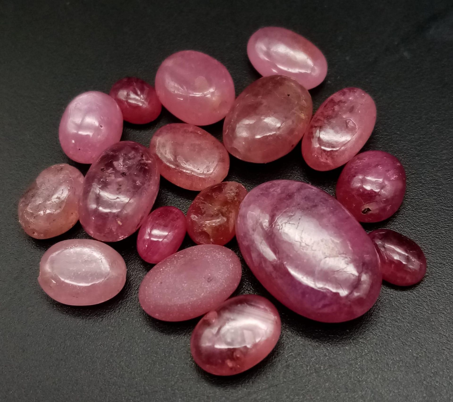 A lot of 43.85Ct Cabochon Translucent African Natural Ruby. Mixed shapes.
