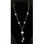 A White Stones Ball design drop pendant Necklace, set in 925 sterling silver chain. Total weight: