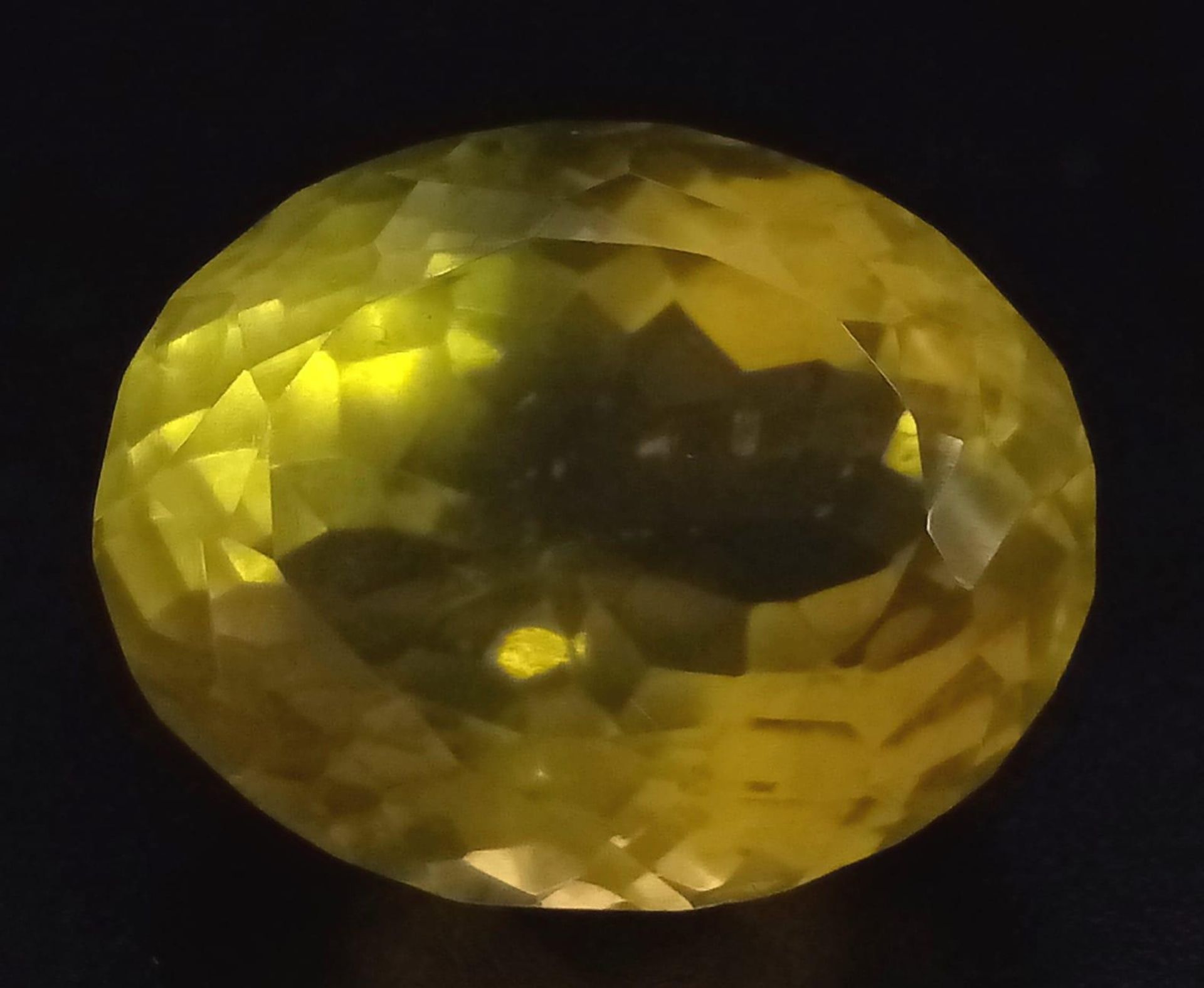 A 23.50ct Natural Lemon Quartz, in Oval Faceted mix cut. Comes with the GLI certificate.