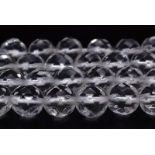a strand of round faceted rock crystal beads (4 mm). Starnd length: 34 cm, weight: 17 g.