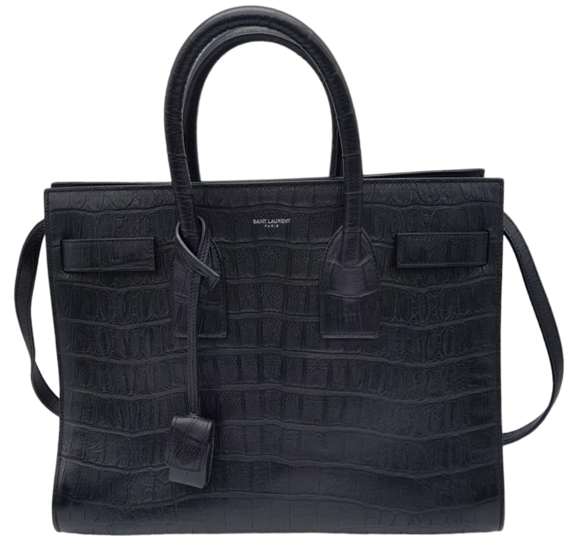 A Saint Laurent Sac de Jour Handbag. Crocodile embossed leather exterior with silver hardware and