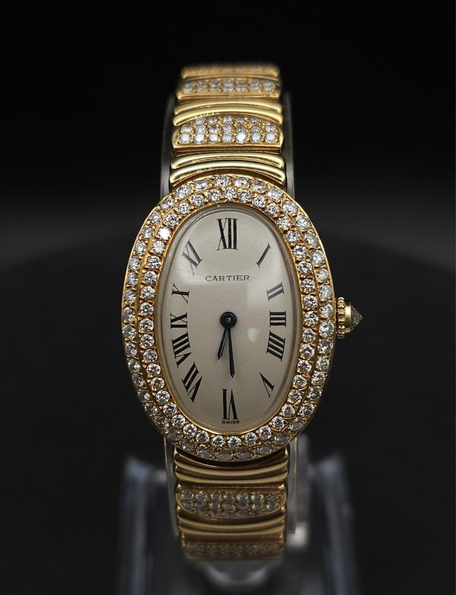 A Cartier Paris 18k Gold and Diamond Ladies Watch. 18k gold and diamond encrusted bracelet and
