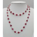 A Round Cut Ruby Gemstone Tennis Necklace set in 925 Silver. 70cm. 27.75g total weight.