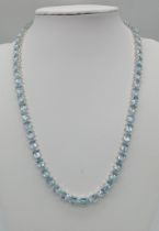 A Scintillating Ice-Blue Topaz Tennis Necklace set in 925 Silver. 45cm length.