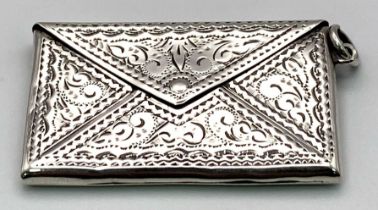 An Antique Sterling Silver Double Stamp Case. Envelope design with elaborate engraving. Hallmarks