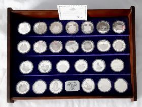A Limited Edition New Elizabethan Age Set of 26 Solid Sterling Silver Coins. Made by the