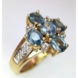 A 9k Yellow Gold Blue Sapphire Cross Ring with Diamond Accents. Size N. 5.85g total weight