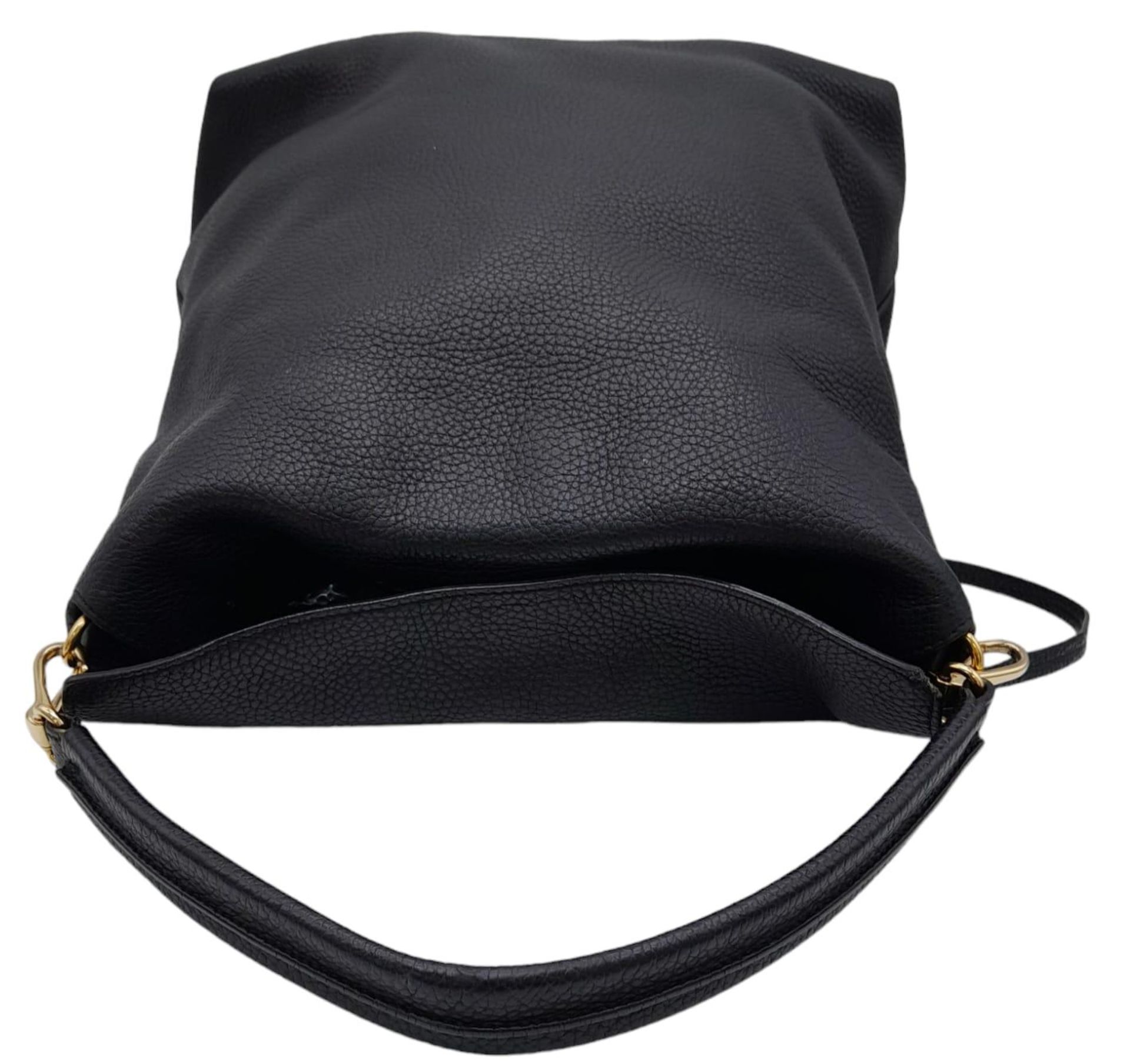 A Burberry Black Cale Hobo Bag. A leather exterior with a looping shoulder strap, gold tone hardware - Image 8 of 23