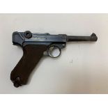 A Deactivated German WW1 Luger P08 Dated 1918. It bears full matching numbers including the