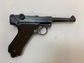 A Deactivated German WW1 Luger P08 Dated 1918. It bears full matching numbers including the