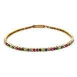 A 14K YELLOW GOLD MULTI COLOUR STONE TENNIS BRACELET 2.7G. Length: 18.5CM