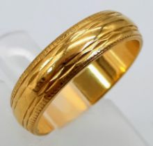 An 18K Yellow Gold Band Ring. Full UK hallmarks. Size L/M. 4.1g weight.