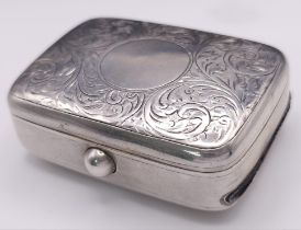 An Antique Sterling Silver Vesta Case . Scroll engraved lid with empty cartouche. Hinge works