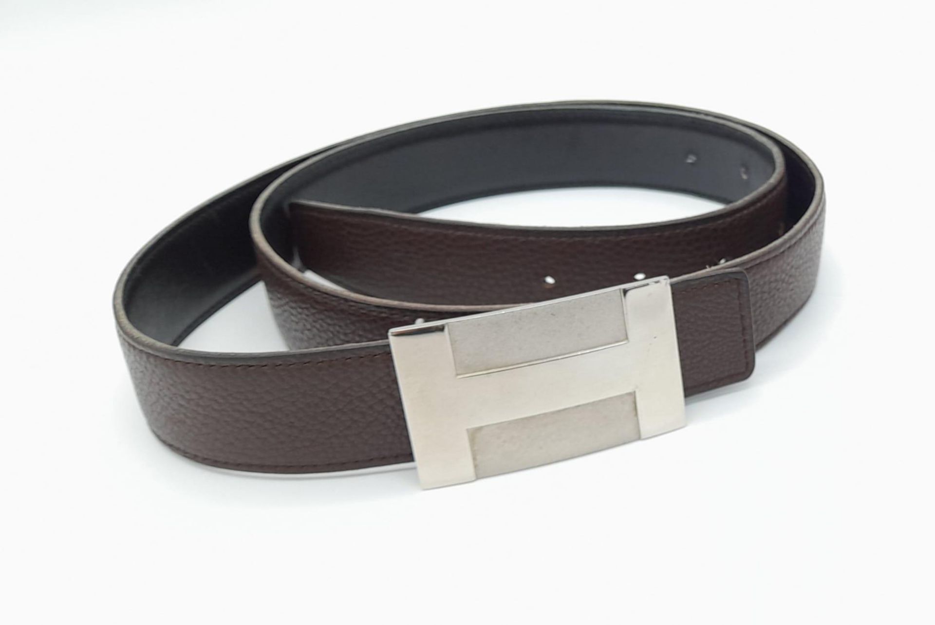 Brown Leather HERMES Belt. Features large Hermes H belt buckle and measures 110cm in length. See