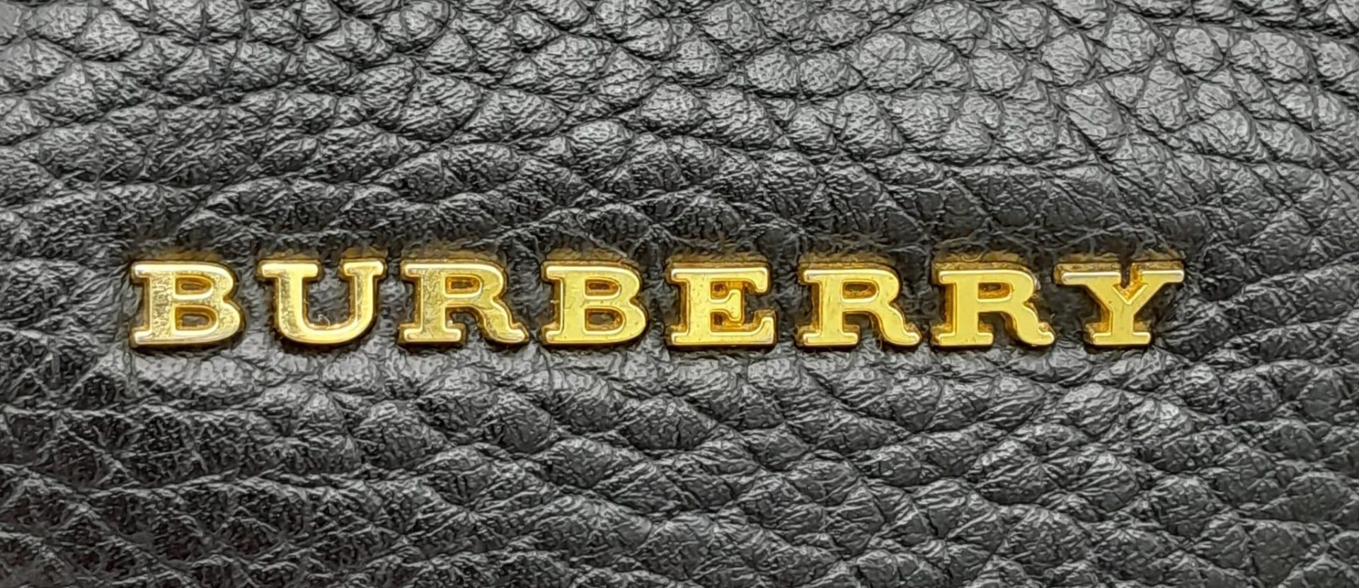 A Burberry Black Cale Hobo Bag. A leather exterior with a looping shoulder strap, gold tone hardware - Image 21 of 23
