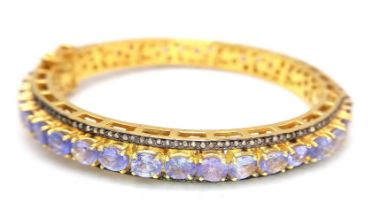 A Sensational Gilded 925 Silver Tanzanite and Diamond Gemstone Tennis Bracelet. Clip open design.