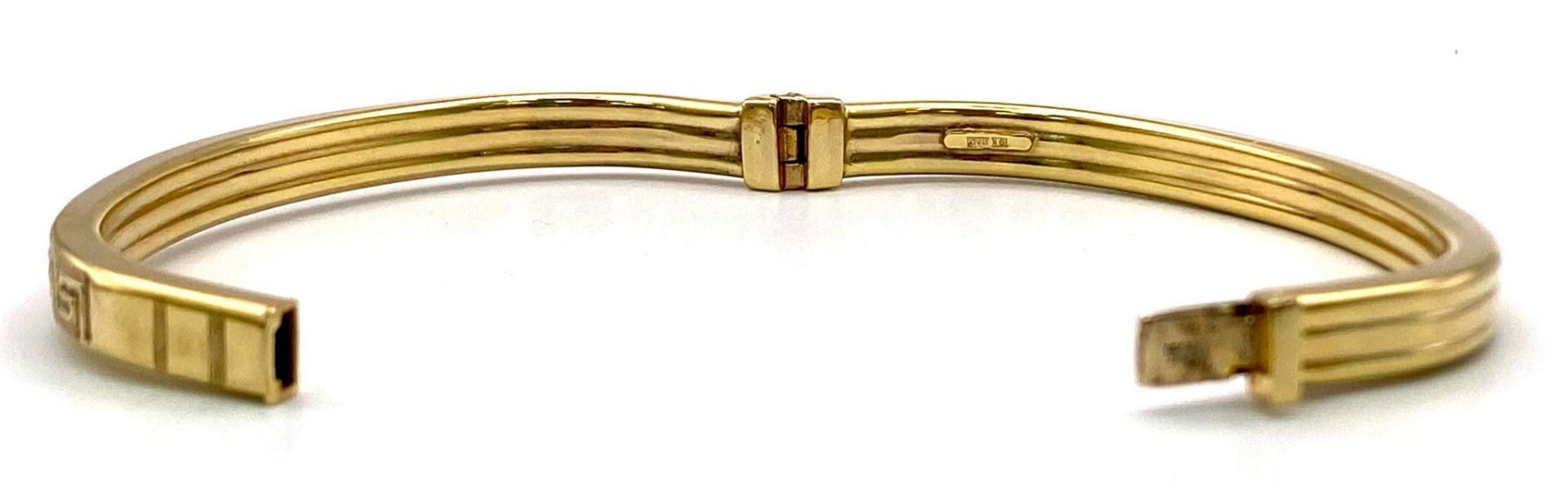 A 9K GOLD ITALIAN DESIGNER HINGED BANGLE WITH GREEK PATTERN ON ONE SIDE . 10.2gms - Image 3 of 5