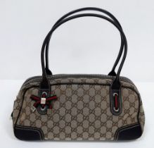 Gucci Princy Bag beige/brown. GG monogram patterning, quality leather with gold tone hardware. Comes