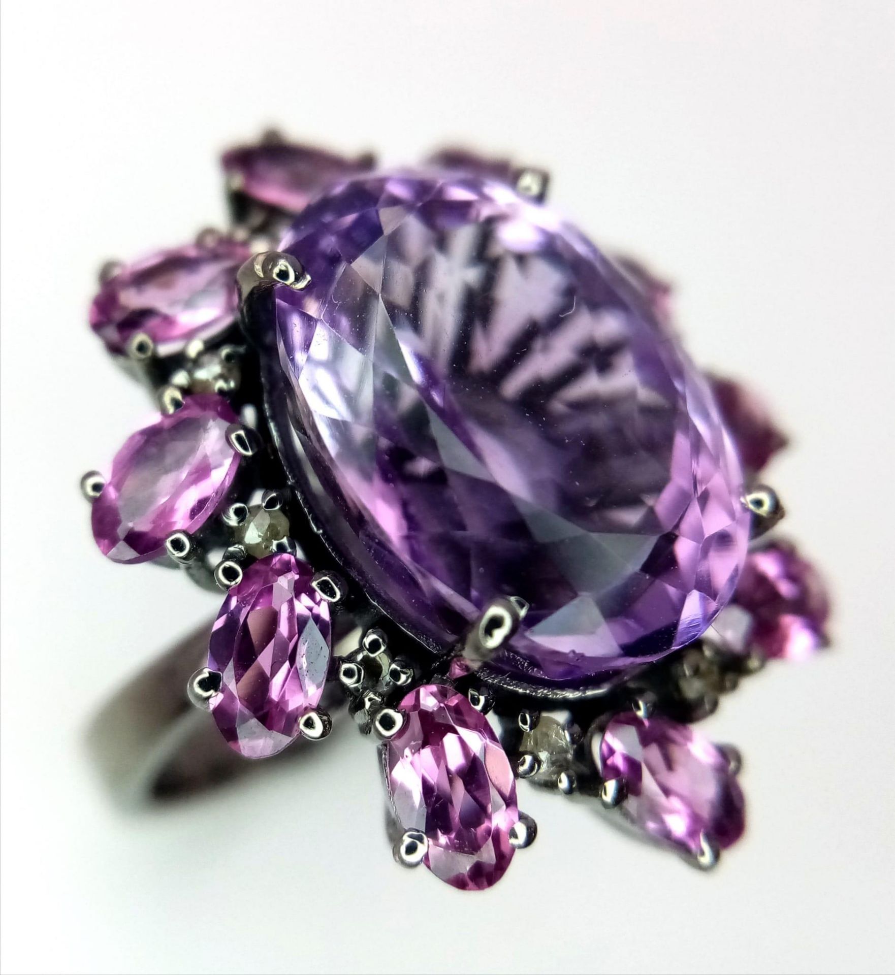 An Amethyst and Rhodolite 925 Silver Ring with Rose cut Diamond Accents. Amethyst - 13.55ctw.