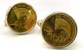 A Pair of 9K Yellow Gold Commemorative Cufflinks - 10 Years of Freedom. 12.9g total weight