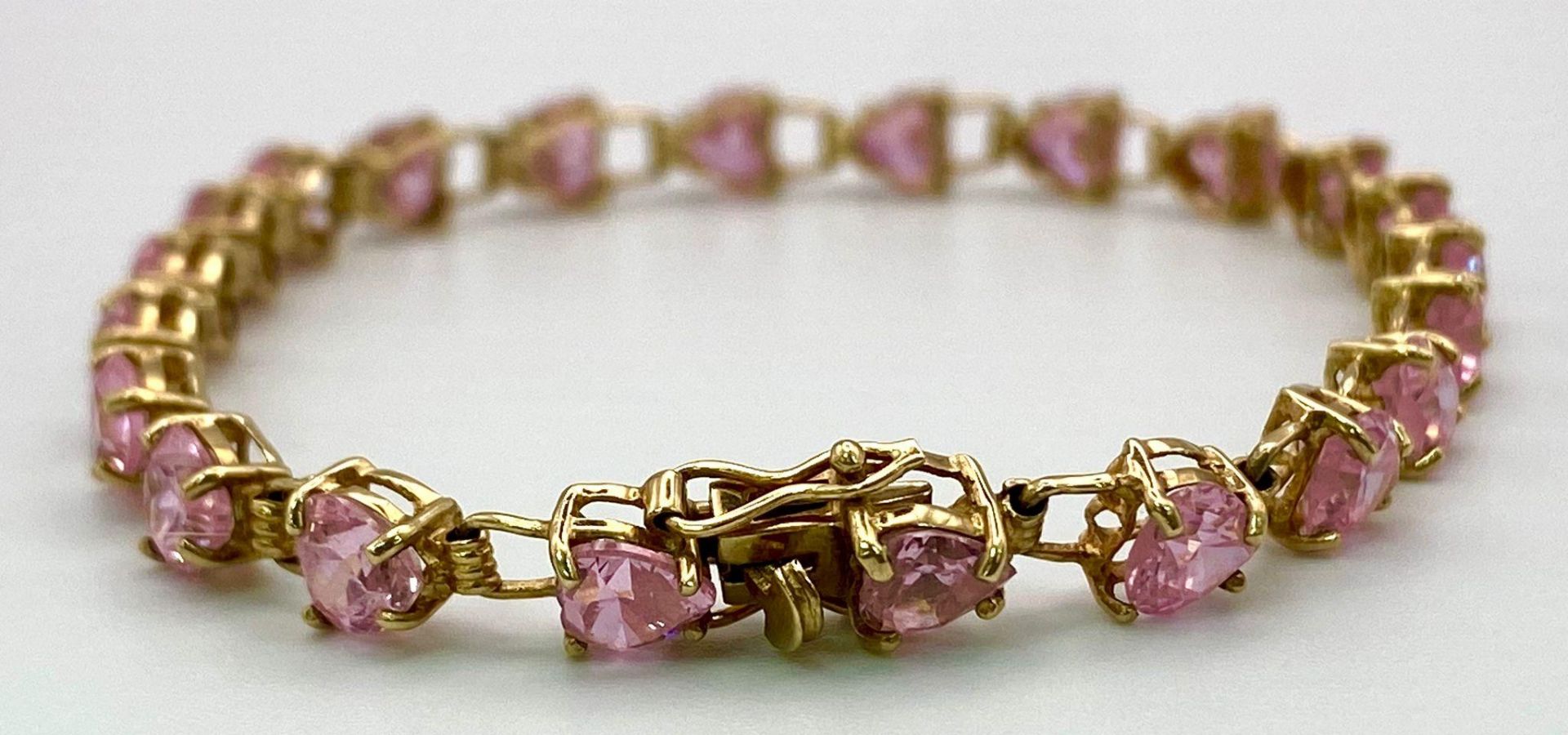 A 9K Yellow Gold Pink CZ Tennis Bracelet. 19cm. 8.86g total weight. - Image 3 of 5