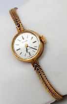 A Vintage 9K Yellow Gold Accurist Ladies Watch. 9K gold bracelet and case - 18mm. Mechanical