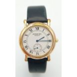 A Classic Raymond Weil Gents Dress Watch. Black leather strap. Gold plated case - 33mm. White dial